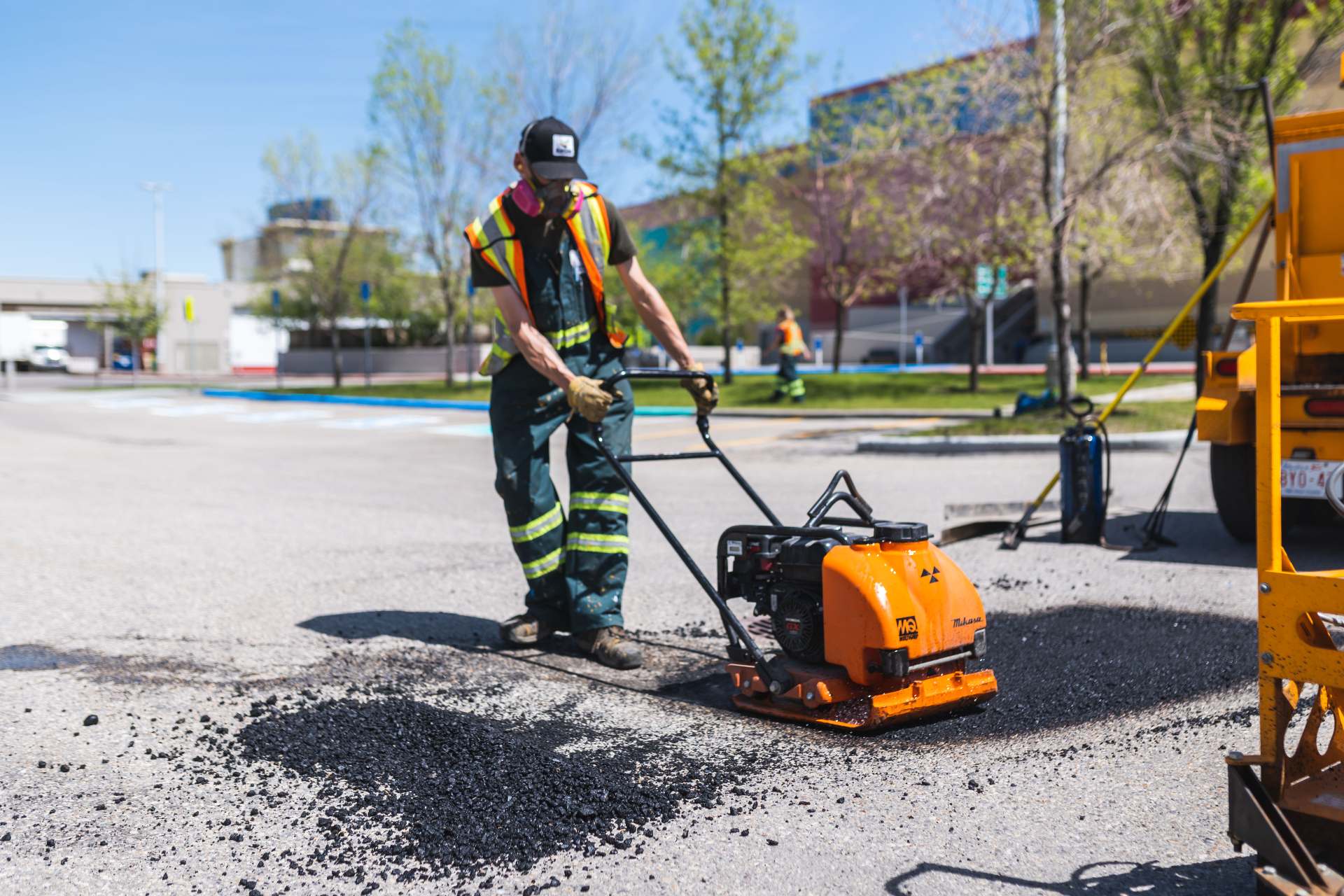 image of everline specialist doing asphalt repair