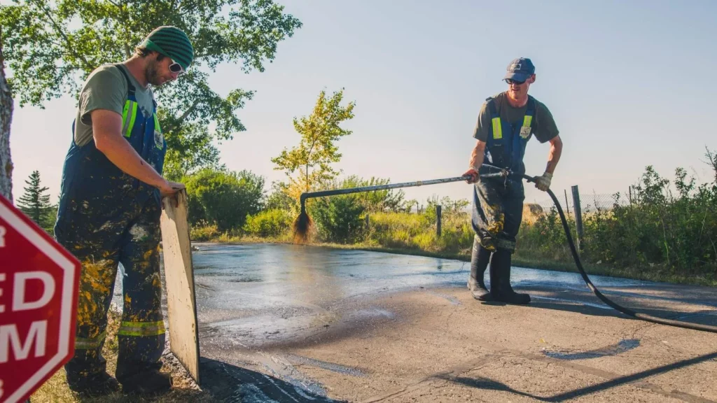 image of everline specialist doing asphalt sealcoating