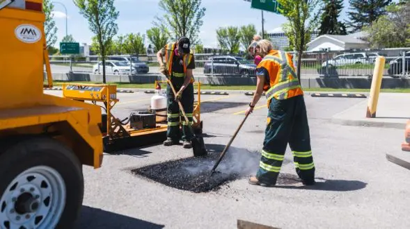 image of everline specialist doing infrared asphalt repair