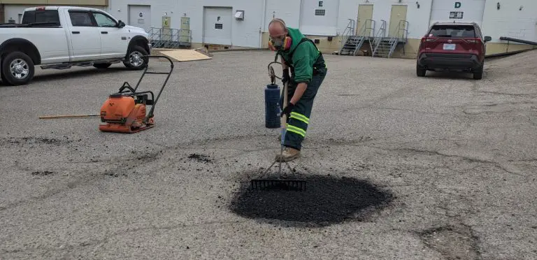 image of an everline specialist doing asphalt repair