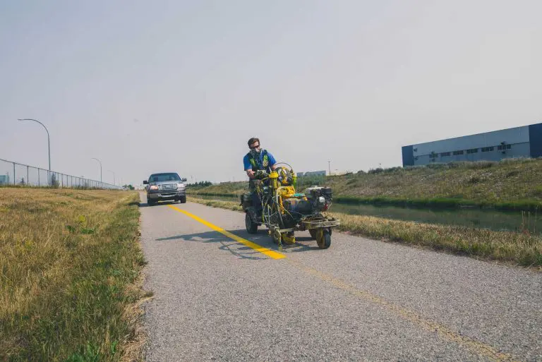 image of a man doing line stripping