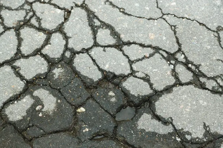 image of an asphalt pavement with cracks