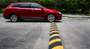 image of car passing on a speed bump