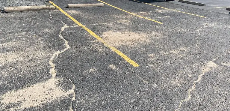 image of a parking lot where lines are faded